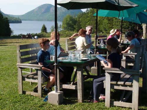tourists having an early supper at Jordan Pond House at Acadia National Park in Maine