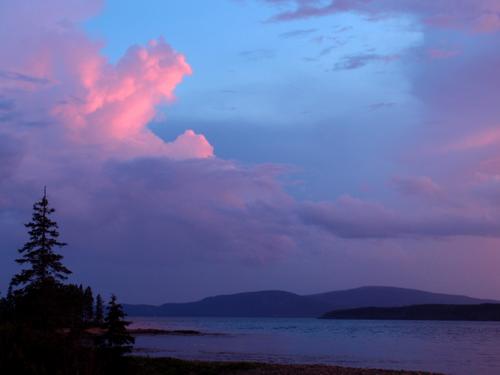 sunset view from Winter Harbor across the bay toward Acadia National Park in Maine