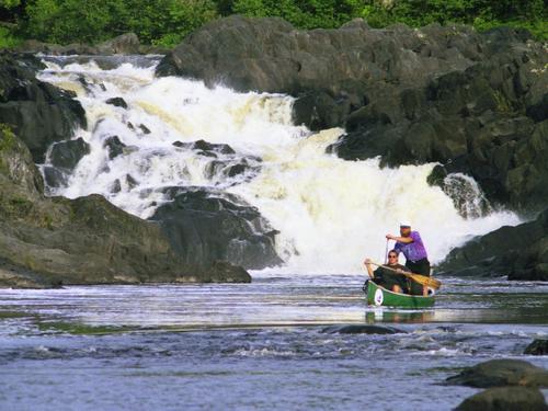 Linda and Peter paddle away from the base of Allagash Falls on the Allagash Wilderness Waterway in northern Maine