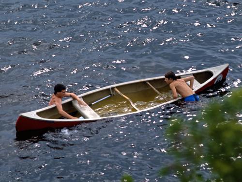 Dave and Eric swamp their canoe near campsite on the Allagash Wilderness Waterway in northern Maine