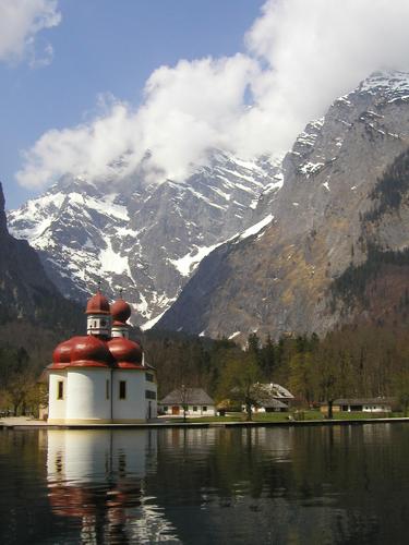 St. Bartholoma Chapel and the Bavarian Alps as seen from Konigssee lake in Germany