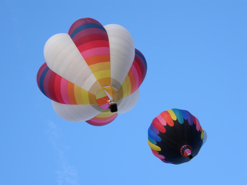 a pair of balloons overhead at the Albuquerque Balloon Festival in New Mexico