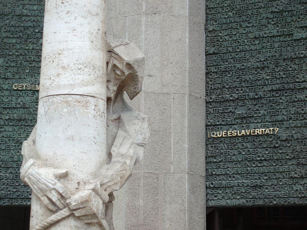 a modern-art statue of Jesus outside the Sagrada Familia church at Barcelona in Spain