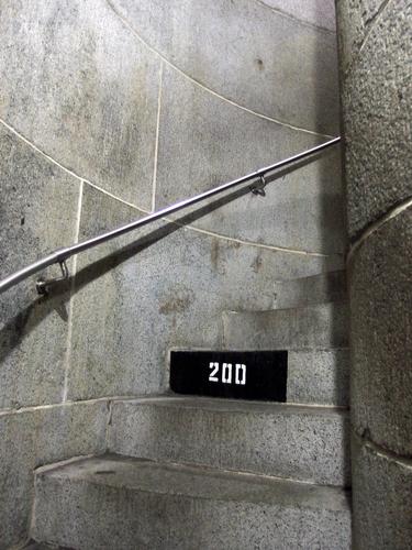 spiral staircase with a numbered step inside the Bunker Hill Monument near Boston