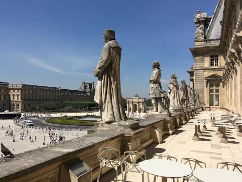 view from a lunch-area balcony into the courtyard of the Louvre in Paris, France