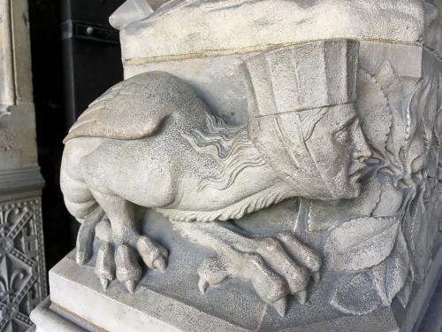 weird creature decorating a column at Sainte-Chapelle in Paris, France