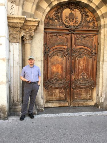 David at a fancy wooden door at Lyon in France