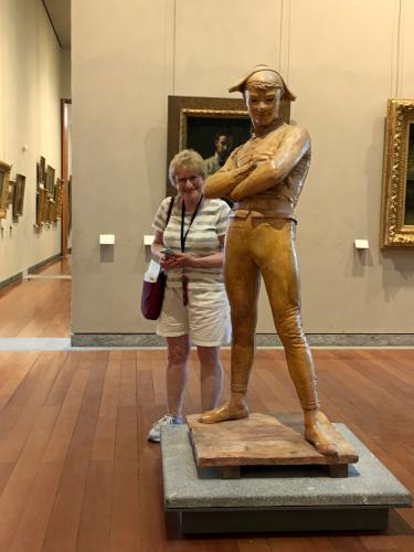 Andee and a statue at the Museum of Fine Arts of Lyon in France