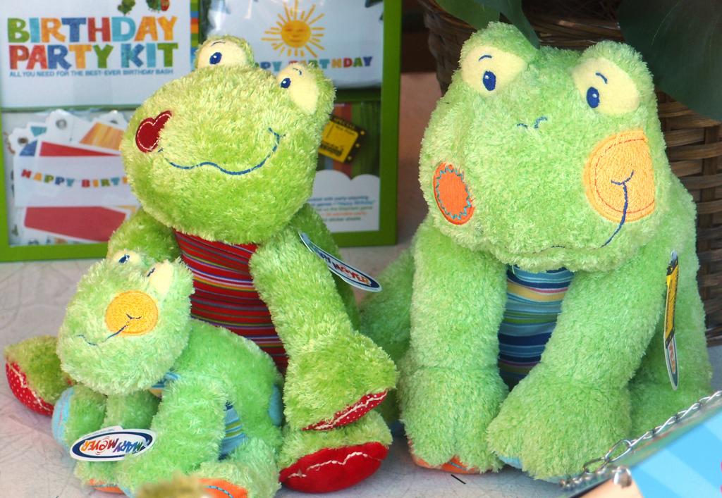 family of stuffed frogs