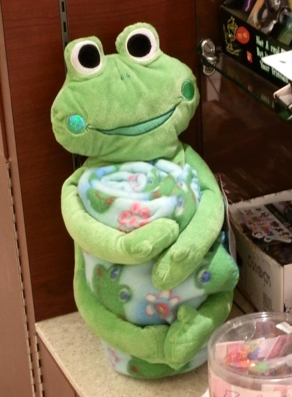 stuffed frog with a frog-motif mini-blanket