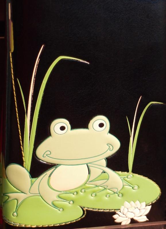 frog-motif leather bookcover