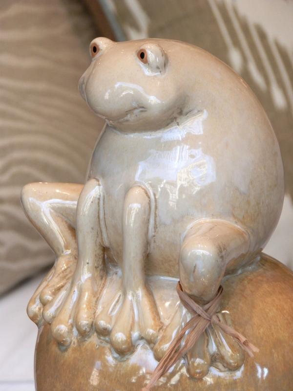 ceramic frog on a ball