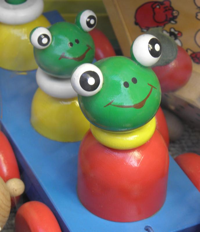 wooden frogs on a cart