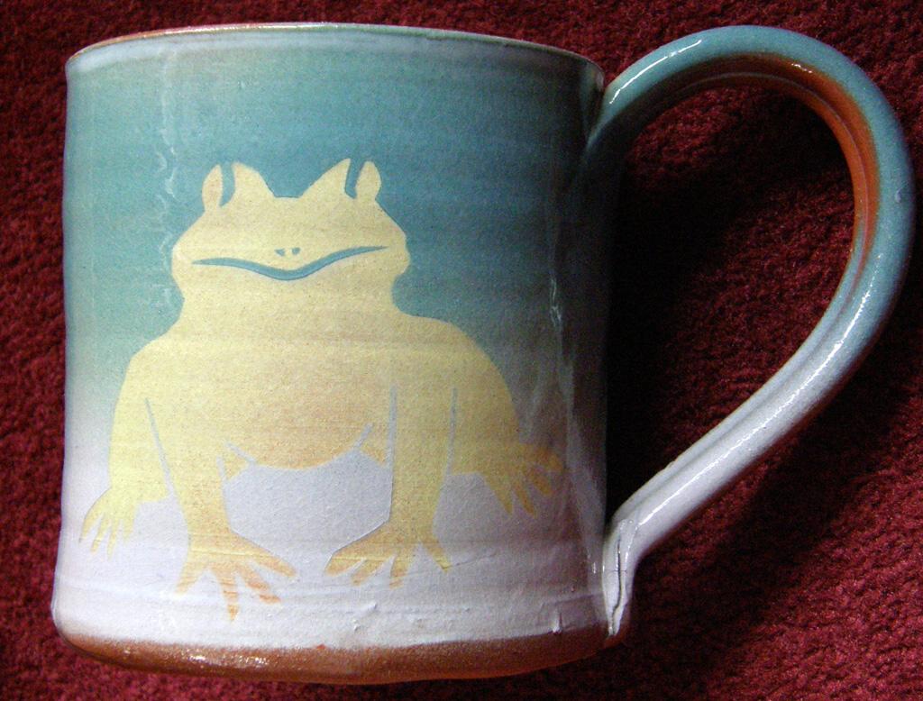 ceramic mug with frog motif