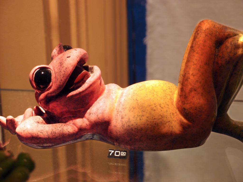 reclining ceramic frog