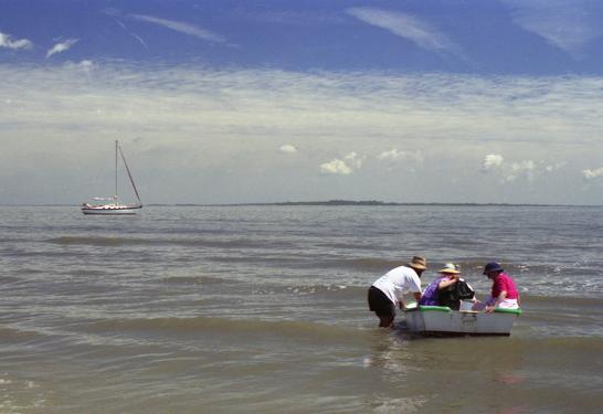 going by dinghy from motor-sailor to beach on the Georgia Coast in April 1990