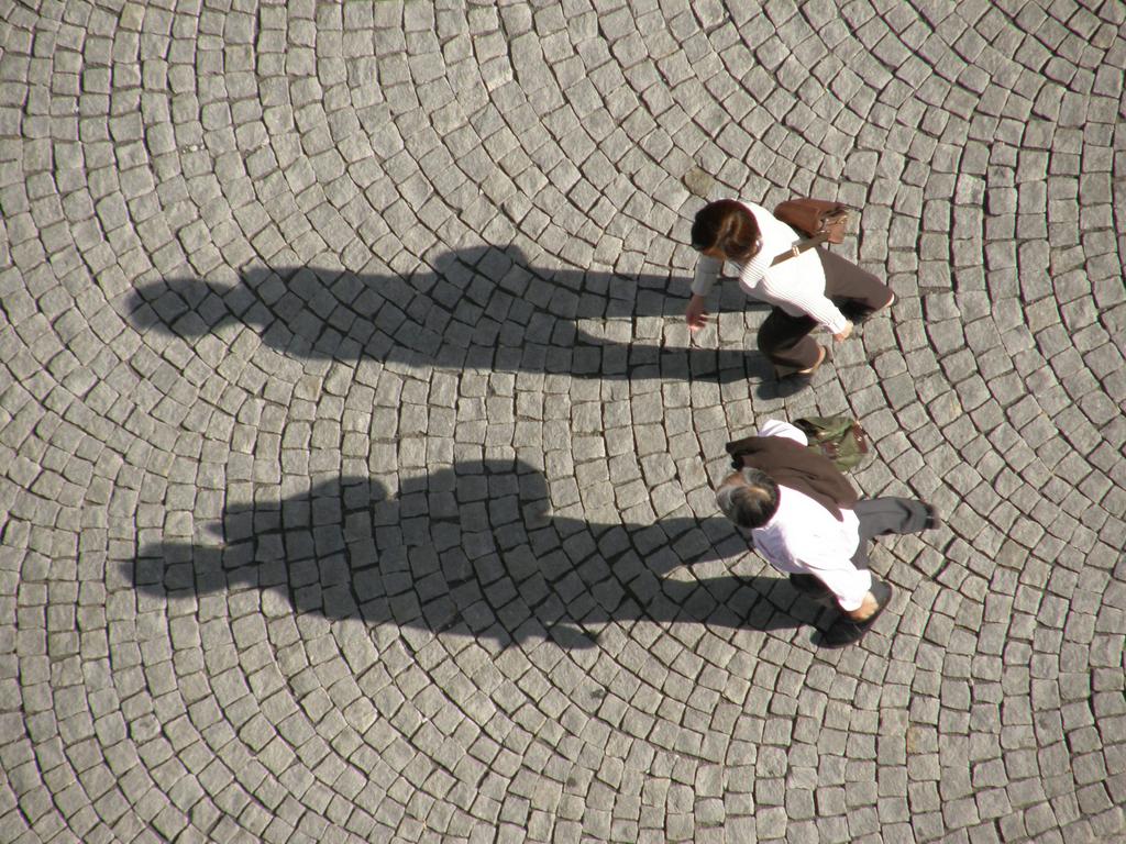 downward view from Thomaskirche's bell tower of plaza strollers at Leipzig in Germany