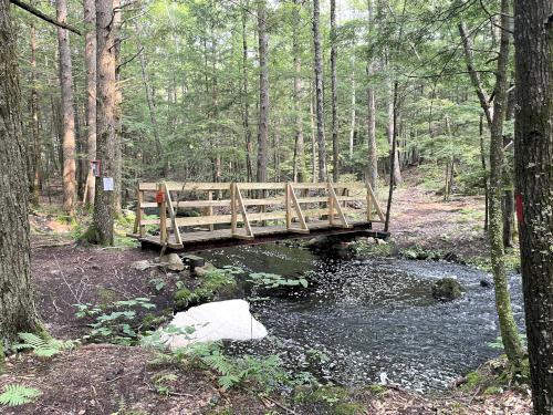 Bumfagon Brook bridge in July at Bachelder Trails near Loudon in southern New Hampshire