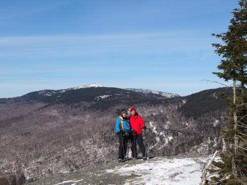 Dick and Fred pose for a photo on the ledge summit of Barber Mountain in New Hampshire, with Mount Cardigan in the background