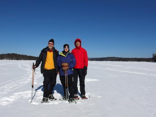 John, Elaine and Fred pose for a photo in February on Lake Winnipesaukee in New Hampshire on the way to Bear Island