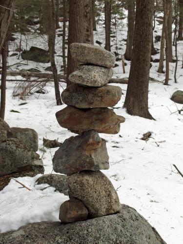 cairn in March at Bell Ledges in southern New Hampshire