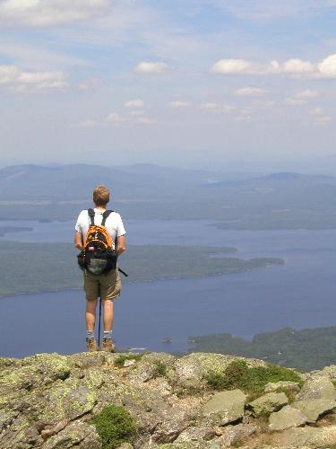 Tom looks over Flagstaff Lake from the summit of Avery Peak on Bigelow Mountain in Maine