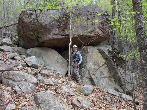 Dick stands by interesting trailside rocks on a hike to Blue Mountain in the White Mountains of New Hampshire