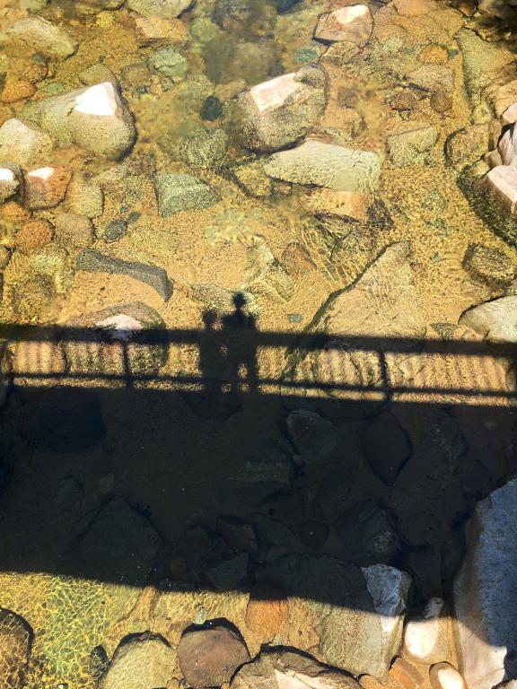 Andee and Fred join an abstract-art shadow from the Rocky Gorge bridge in New Hampshire