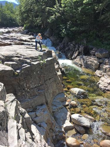 Andee takes a photo at Rocky Gorge near Boulder Loop in New Hampshire