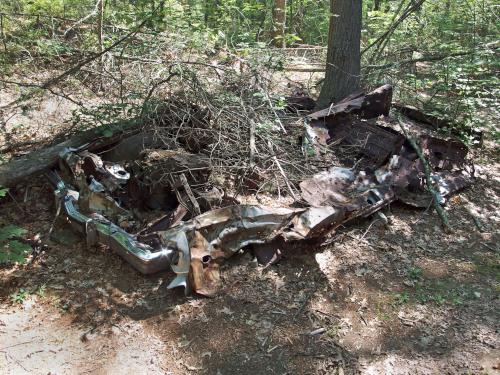 trashed car beside the trail in Boxford State Forest in northeastern Massachusetts