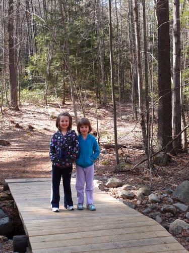 young hikers on the trail to Burns Hill in New Hampshire