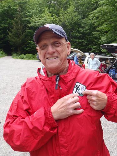 hiker with a 48-over-70 New Hampshire hiking patch