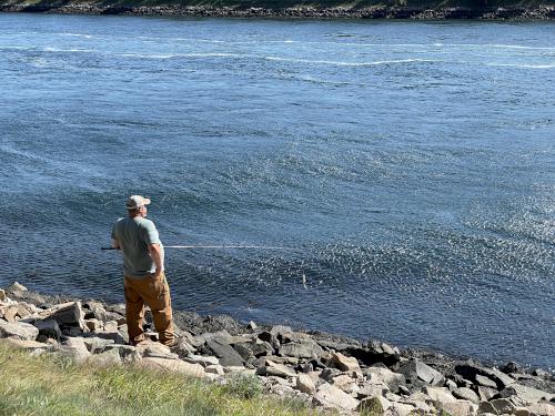 fisherman in October on the Cape Cod Canal Bikeway in eastern Massachusetts