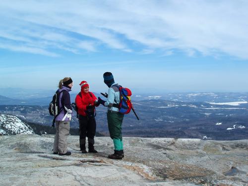 winter hikers on the summit of Mount Cardigan in New Hampshire