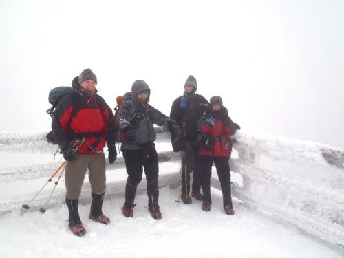 winter hikers on the observation tower on Mount Carrigain in New Hampshire