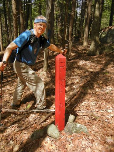 Fred at a boundary marker on Carrolls Hill at Swanzey in southwestern New Hampshire