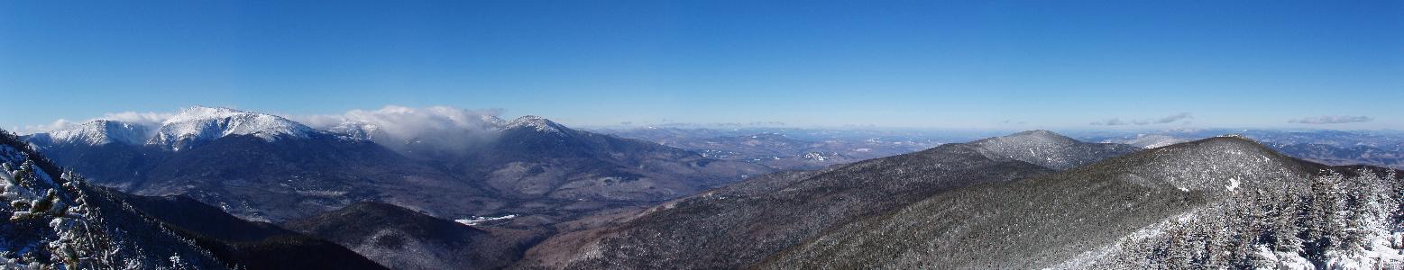 panoramic view in January of the Presidentials from Carter Dome Mountain in the White Mountains of New Hampshire