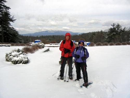 Andee and Fred before the view of Mount Monadnock in February at Cathedral of the Pines near Rindge in southern New Hampshire