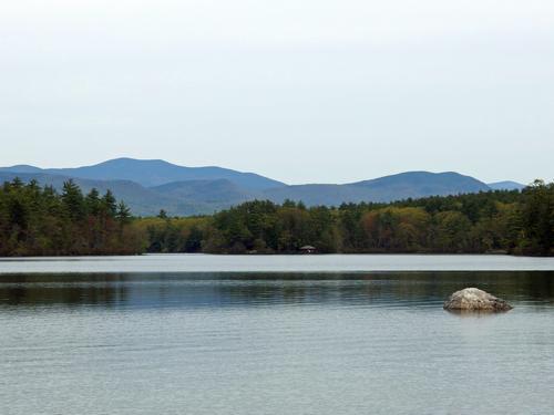 view from the beach on Squam Laek at Chamberlain-Reynolds Memorial Forest in New Hampshire