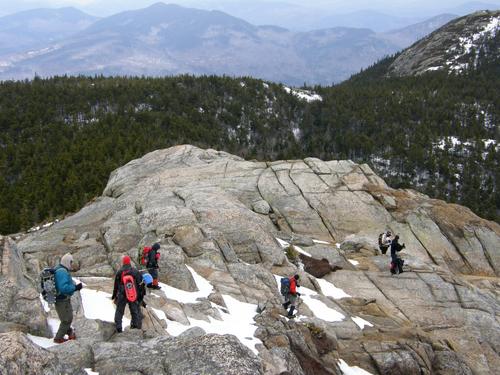 hikers descending Mount Chocorua in New Hampshire