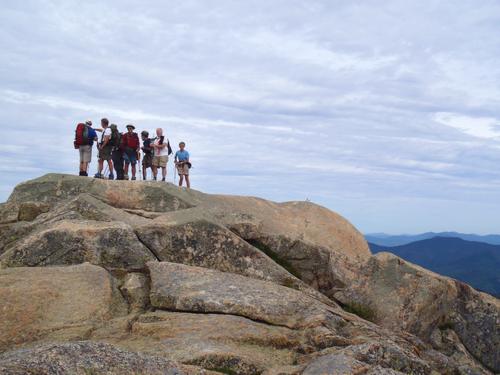 hikers on the summit of Mount Chocorua in New Hampshire