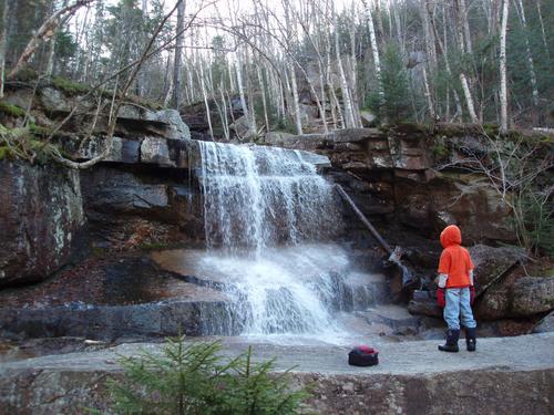young hiker at Champney Falls on the way to Mount Chocorua in New Hampshire