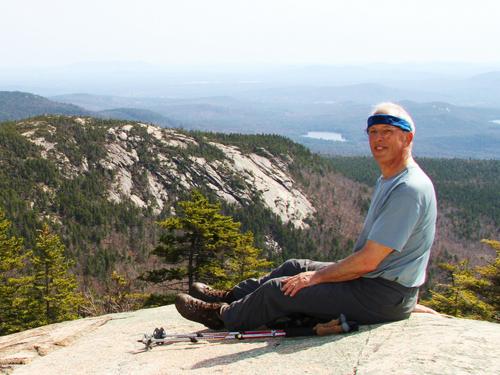 hiker on the Piper Trail to Mount Chocorua in New Hampshire
