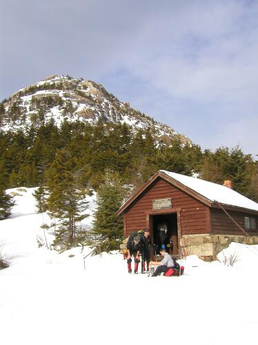 January hikers at Jim Liberty Cabin on the shoulder of Mount Chocorua in New Hampshire