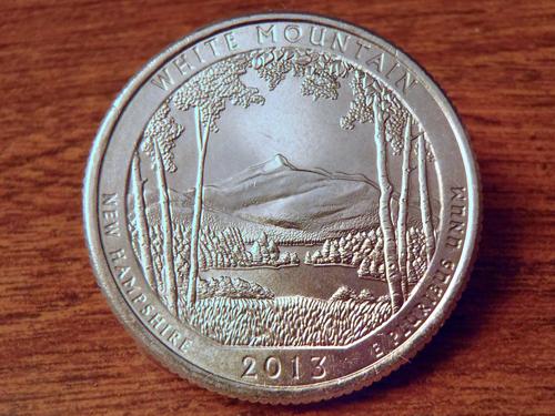 view from Chocorua Lake of Mount Chocorua on the back of the New Hampshire quarter