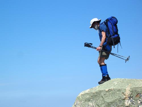 hiker on the summit of Mount Chocorua in New Hampshire