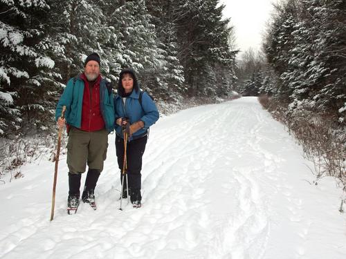 John and Elaine pose for a photo on the entry road during our bushwhack to Mount Cilley and Grandview Mountain in New Hampshire