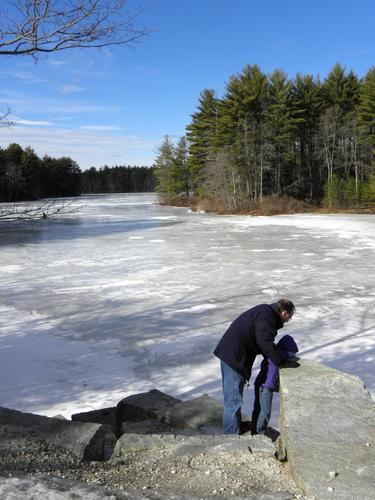 winter hikers at Clark Pond in New Hampshire