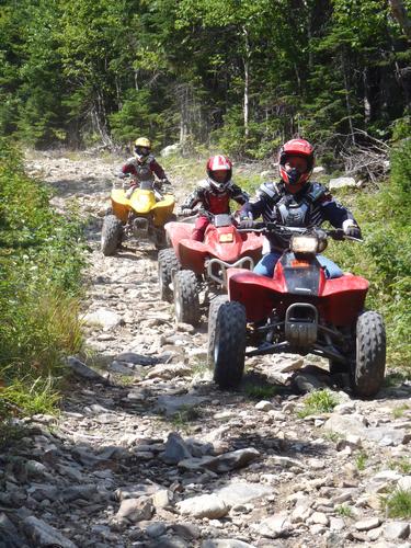 ATVs descending the trail from Coburn Mountain in Maine