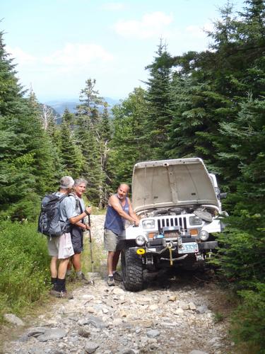 a Jeep stuck on the ATV trail to Coburn Mountain in Maine